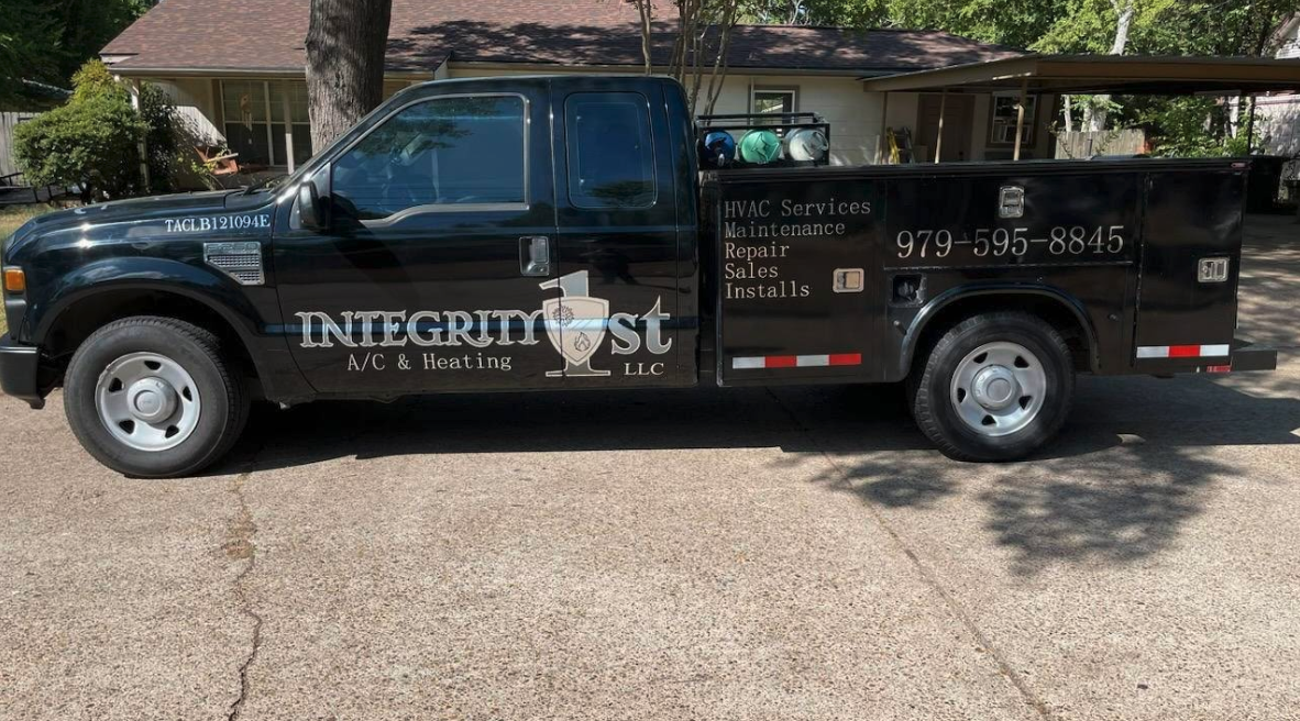 Integrity 1st A/C & Heating technicians at work