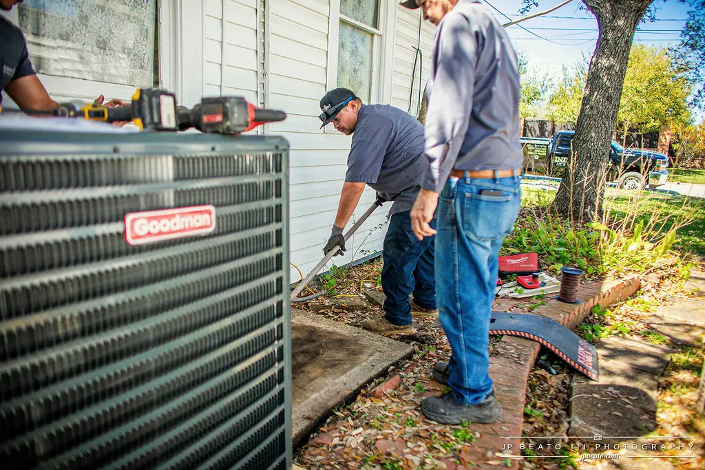 Integrity 1st AC technician servicing an air conditioning unit